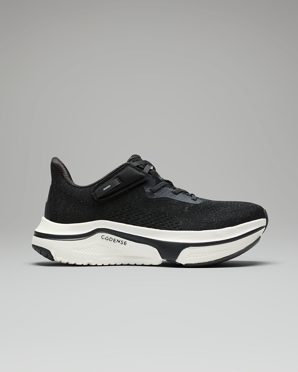 Black and white athletic shoe on a gray background
