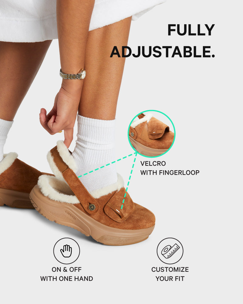 Brown slip-on shoes with a velcro strap and fingerloop, labeled as fully adjustable.
