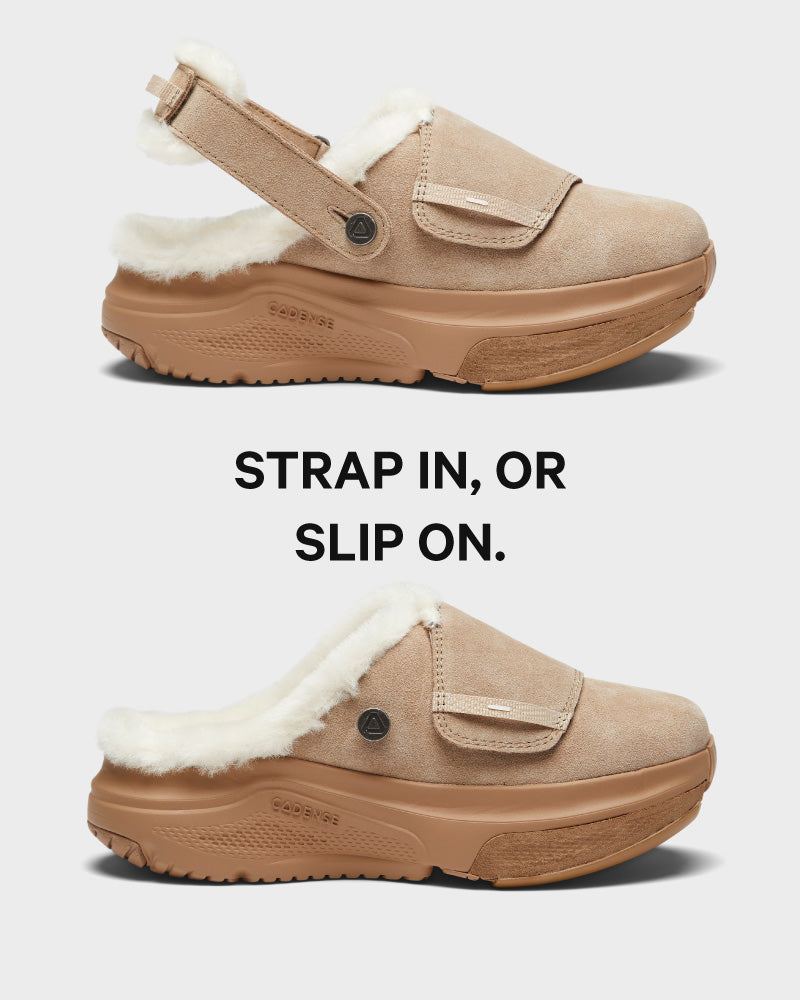 Tan slip-on shoes with white fur lining on a light gray background