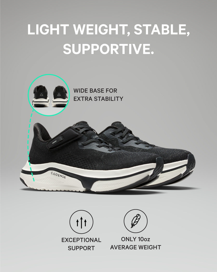 Black running shoes with text highlighting weight, stability, and support on a gray background