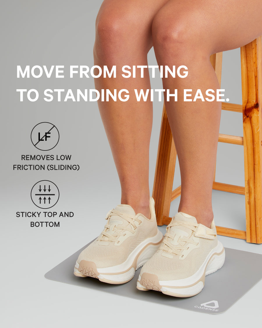 Person wearing beige sneakers on a gray mat with text about shoe features.