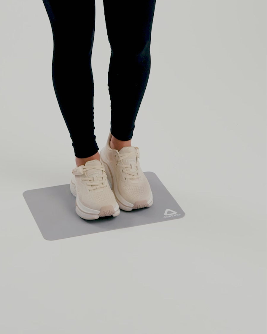 Woman demonstrating how to use the Cadense transition mat