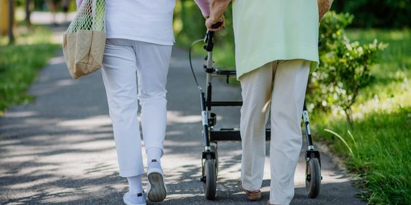 senior walking - Cadense Adaptive Trainers can help with support