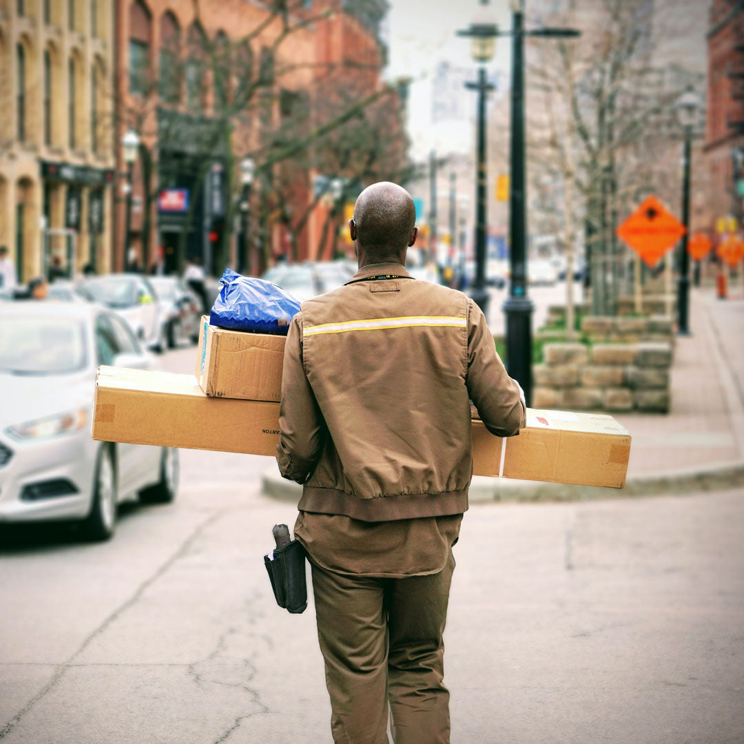 Man carrying packages on a city street