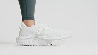 Putting on white shoe