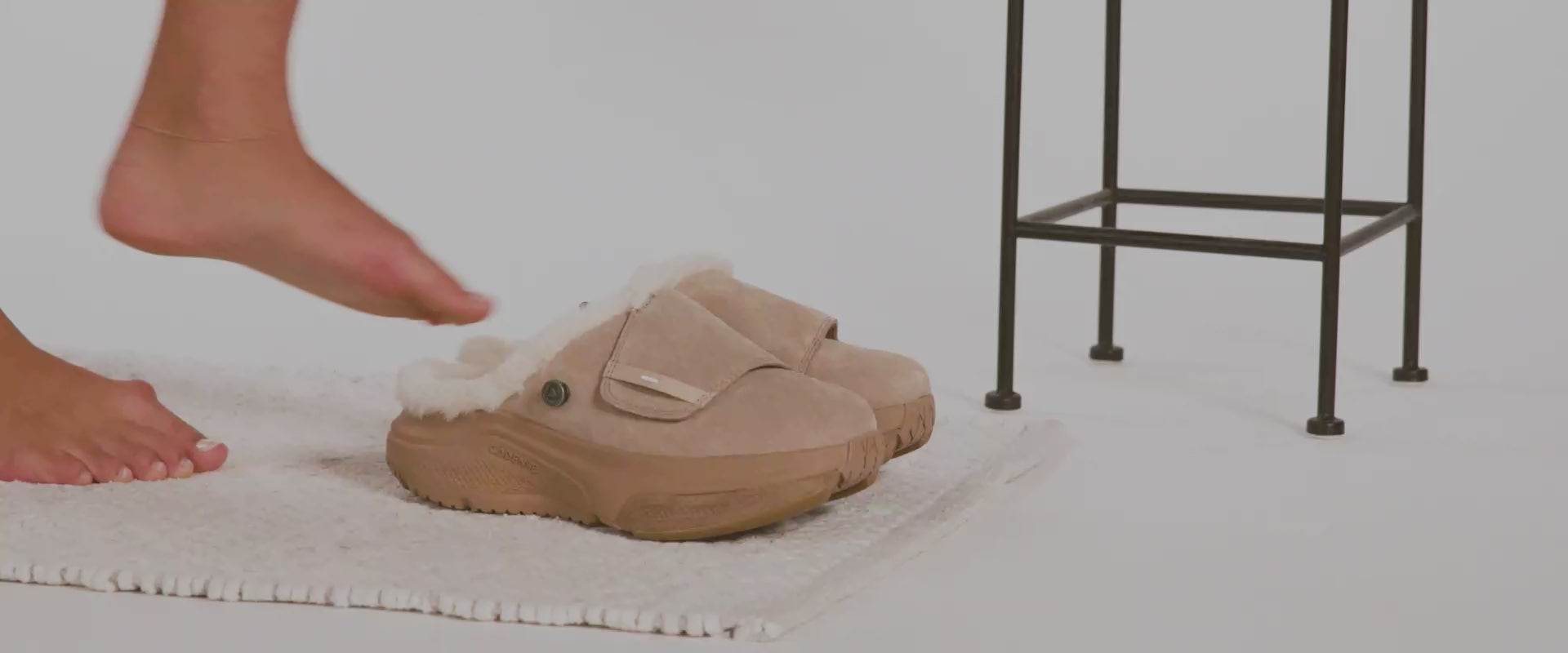 Woman putting on Havena adaptive slippers